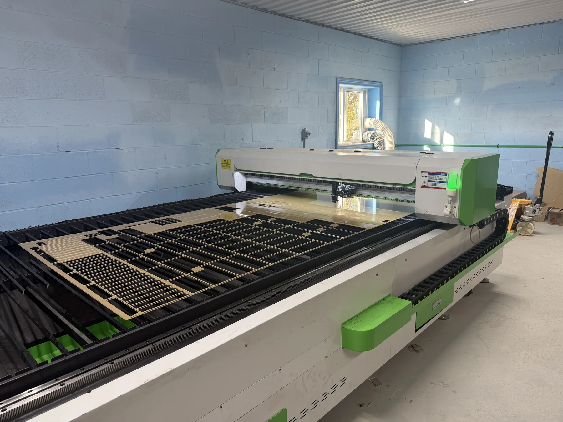 Bescutter laser cutting acrylic on its large cutting bed in the Cedar Hedge Millworks shop